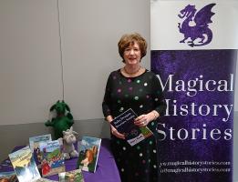 Margaret Hollis with her books